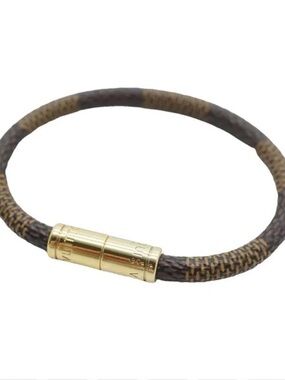 Louis Vuitton Brown Monogram
Canvas Bracelet with Gold-Tone clasp